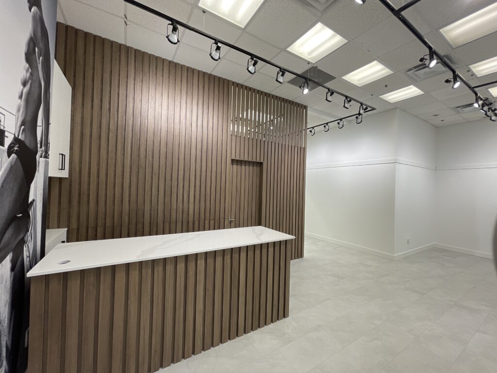 Retail renovation with millwork wall slats and wall art