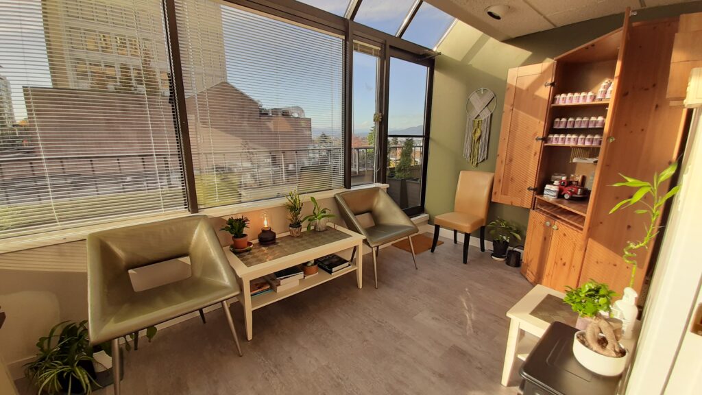 medical office with green chair and oak cupboard