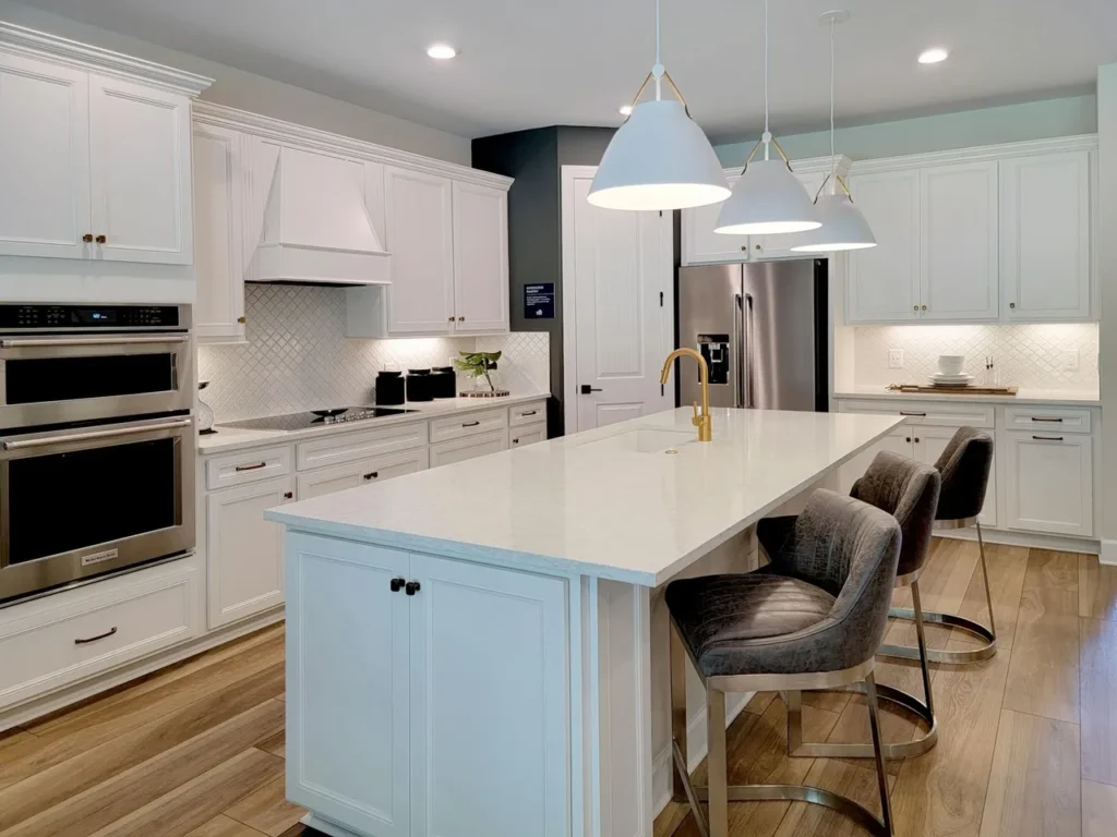 white pendants above a kitchen island