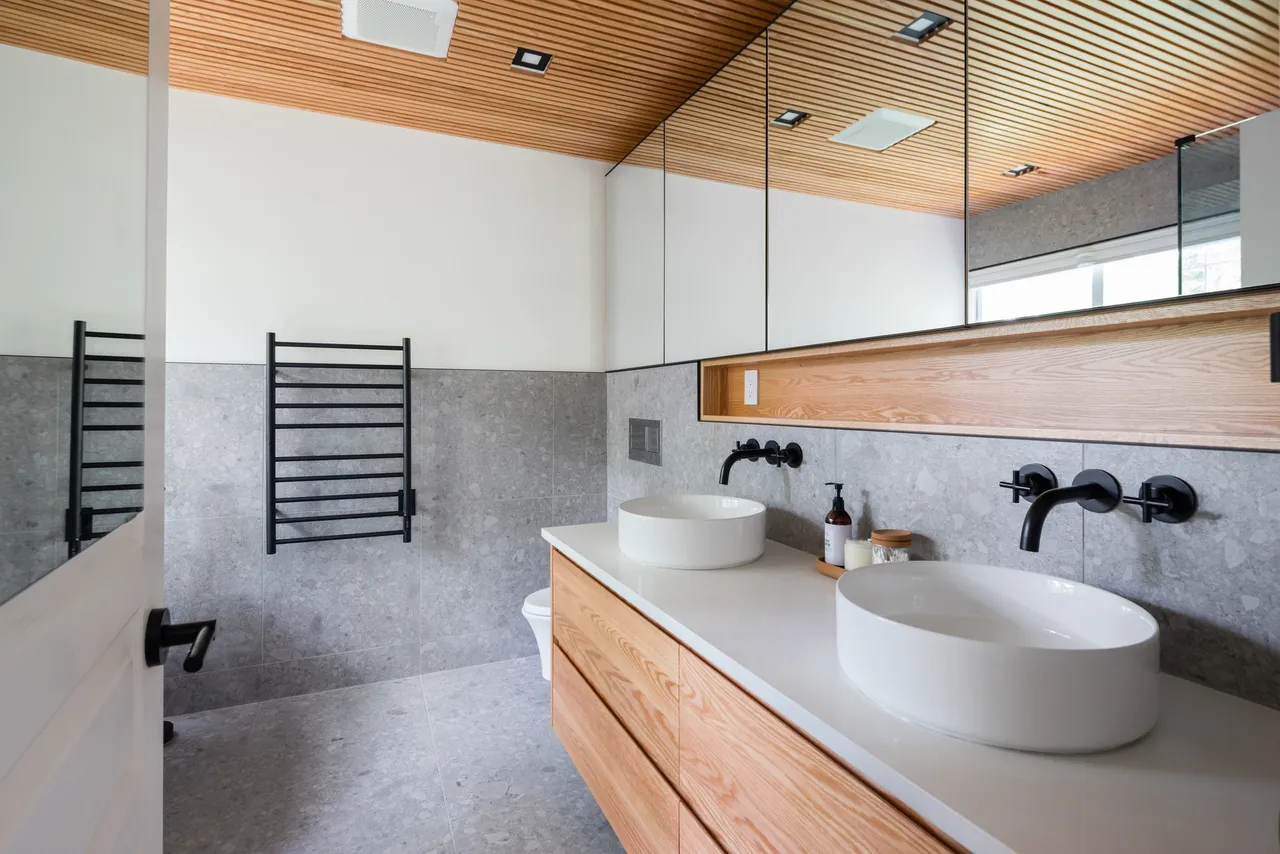 double vanity with vessel sinks and terrazzo tiles