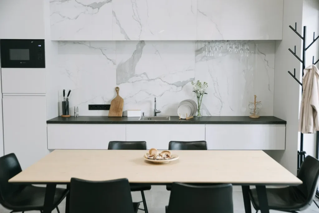 A white kitchen with quartz backsplashes