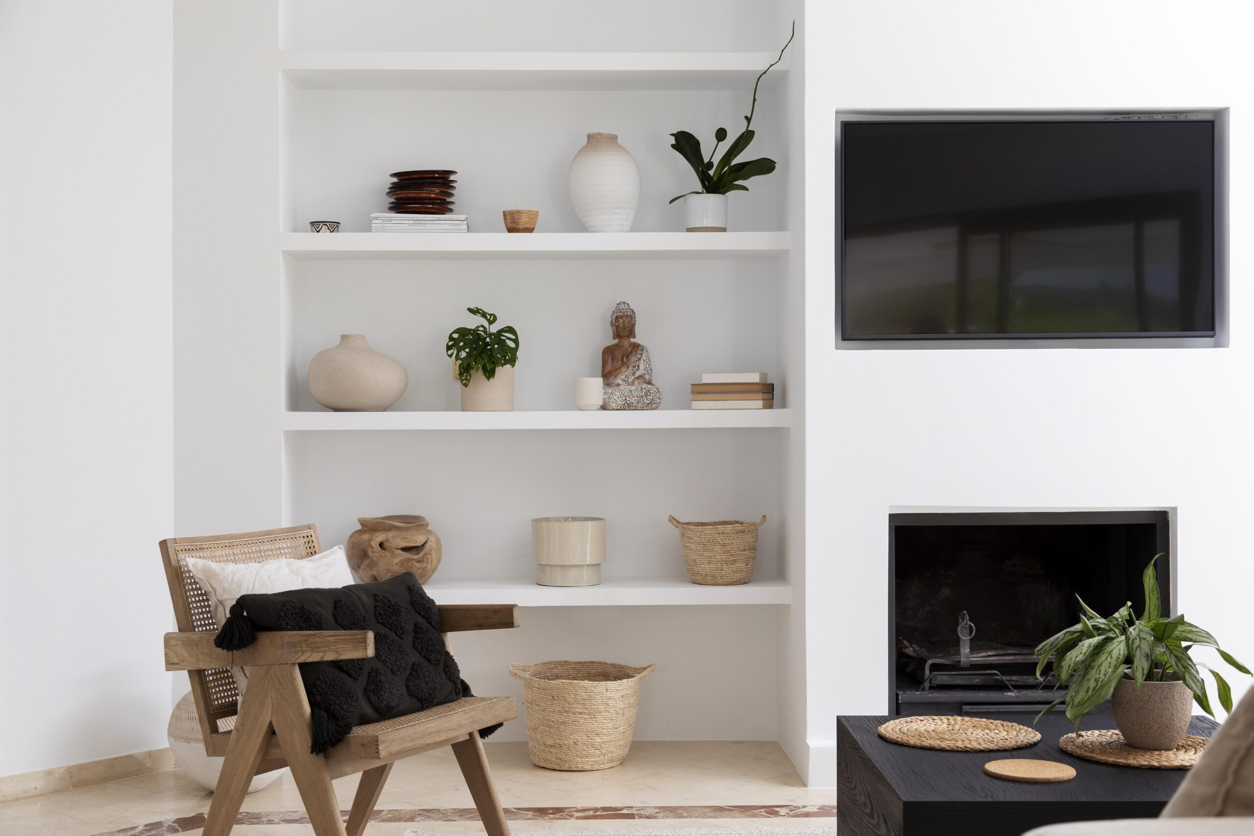 Vancouver Renovations featuring white built-in shelving with vases