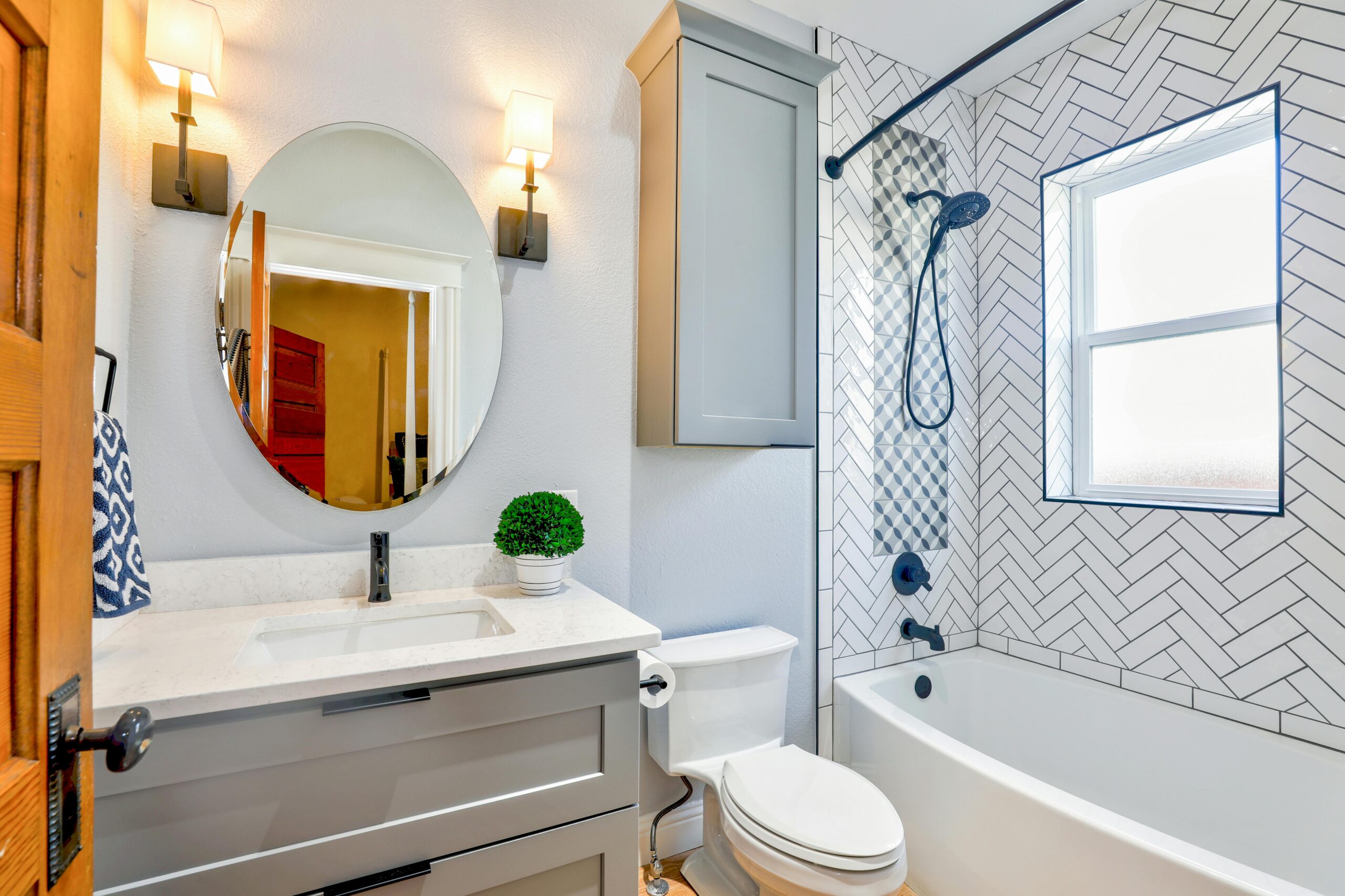 Vancouver Bathroom Renovation featuring white subway tiles and gray vanity