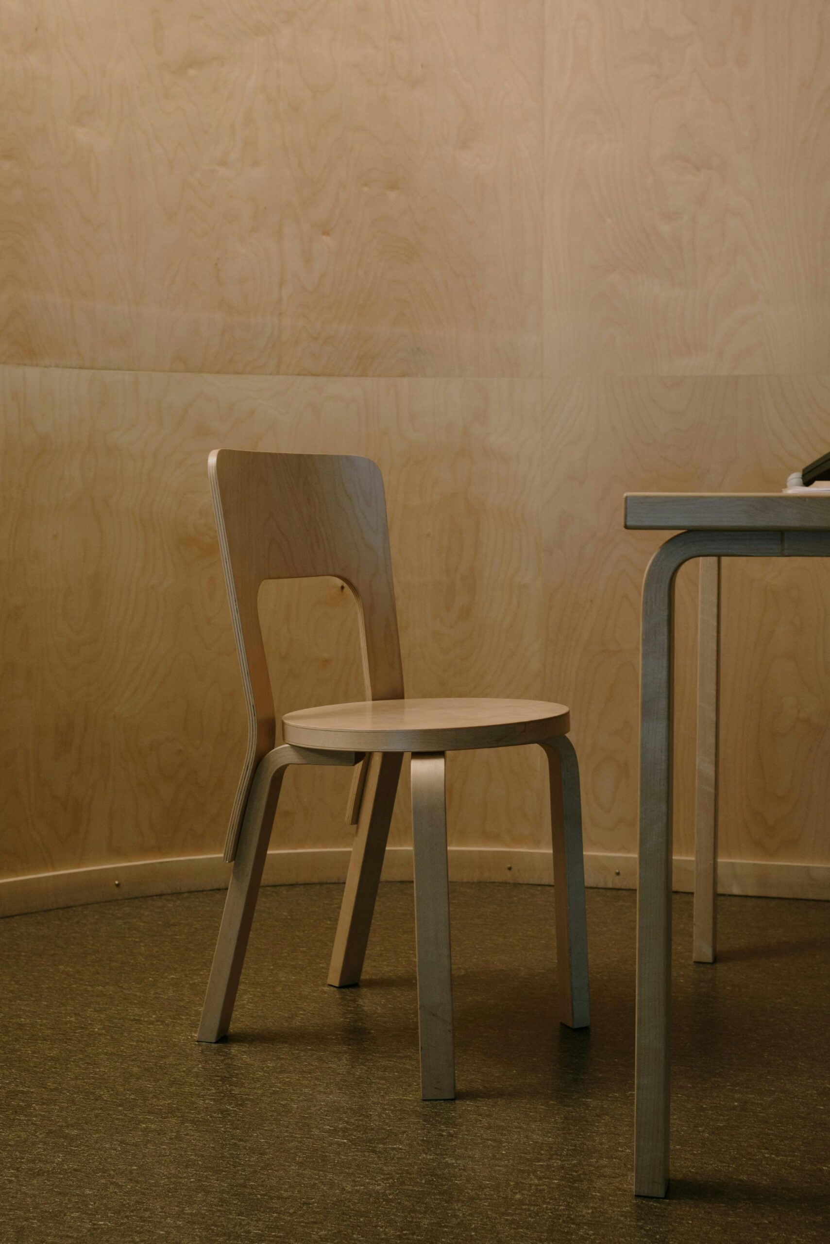 Vancouver house renovation with wooden chair, cork flooring, wood panelled walls, wooden look baseboards, wooden table