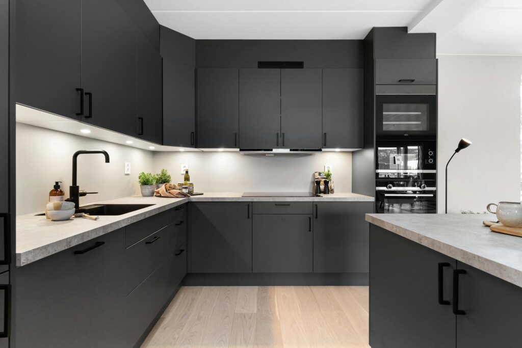 Vancouver Kitchen Renovation featuring engineered hardwood flooring and black cabinets