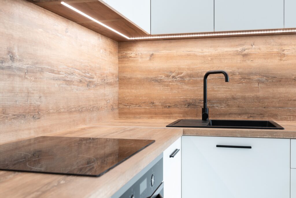 Vancouver Kitchen Renovation featuring white cabinets and wood countertops