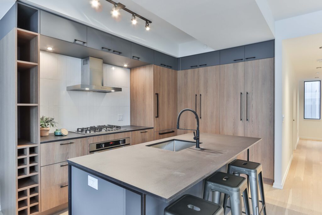 Vancouver Kitchen Renovation featuring wood and grey cabinets with black handles