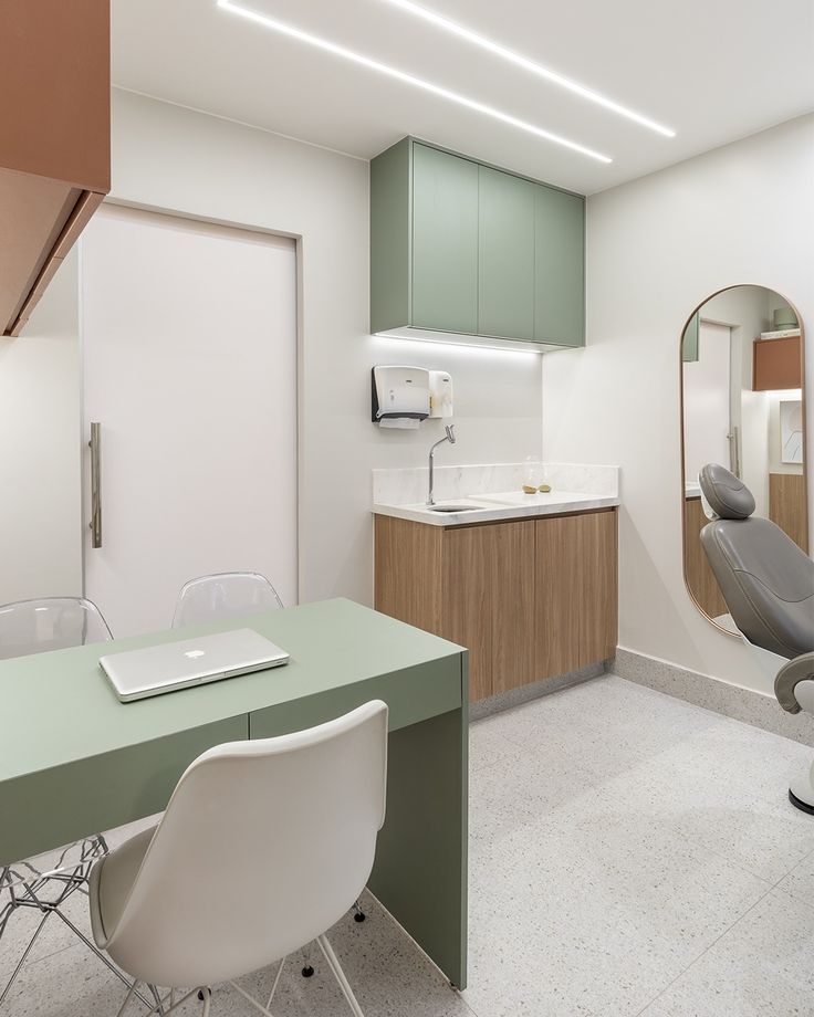 a newly renovated dental office in Vancouver with green and wood two-tone millwork.