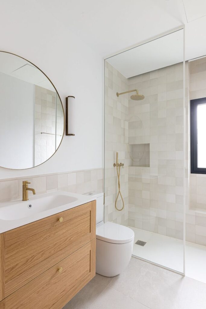 Recessed bathroom storage niches and floating vanity creating spacious feel in small Vancouver bathroom