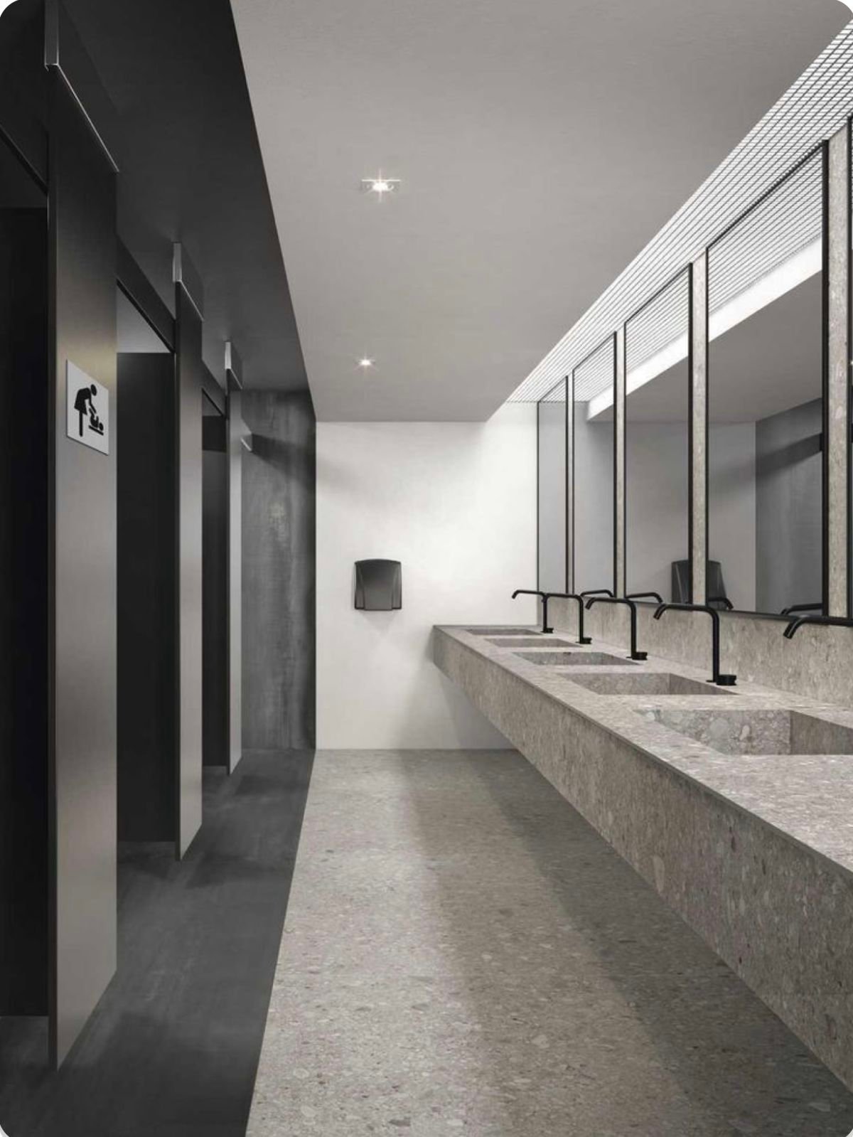 Commercial bathroom renovation with contemporary tile and accessible fixtures