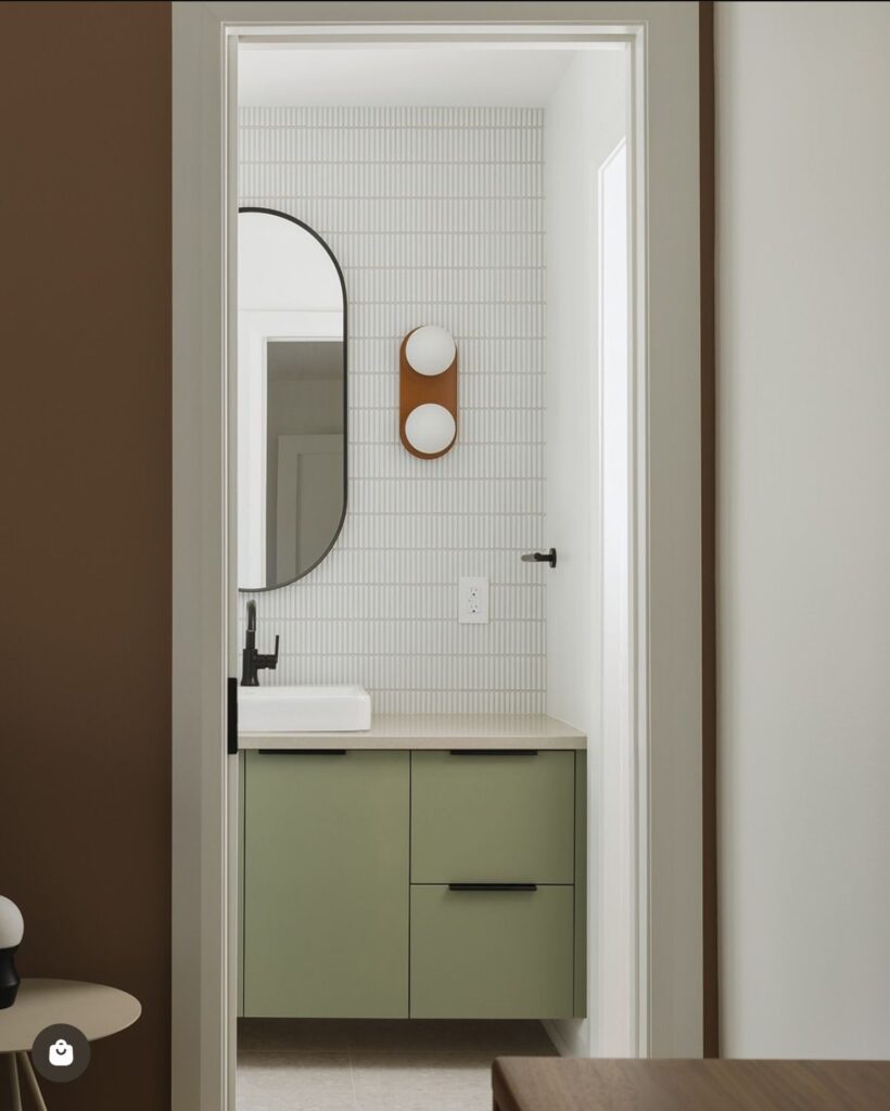 Vancouvver bathroom featuring green custom vanity and black bathroom fixtures
