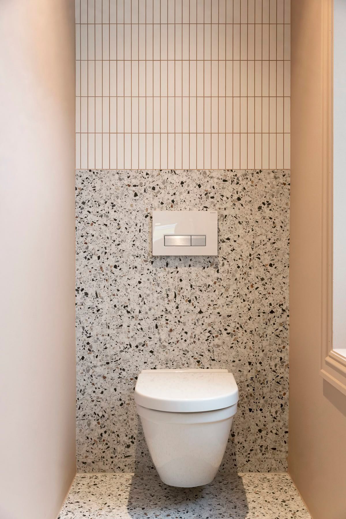 Commercial washroom vanity and mirror installation with modern finishes