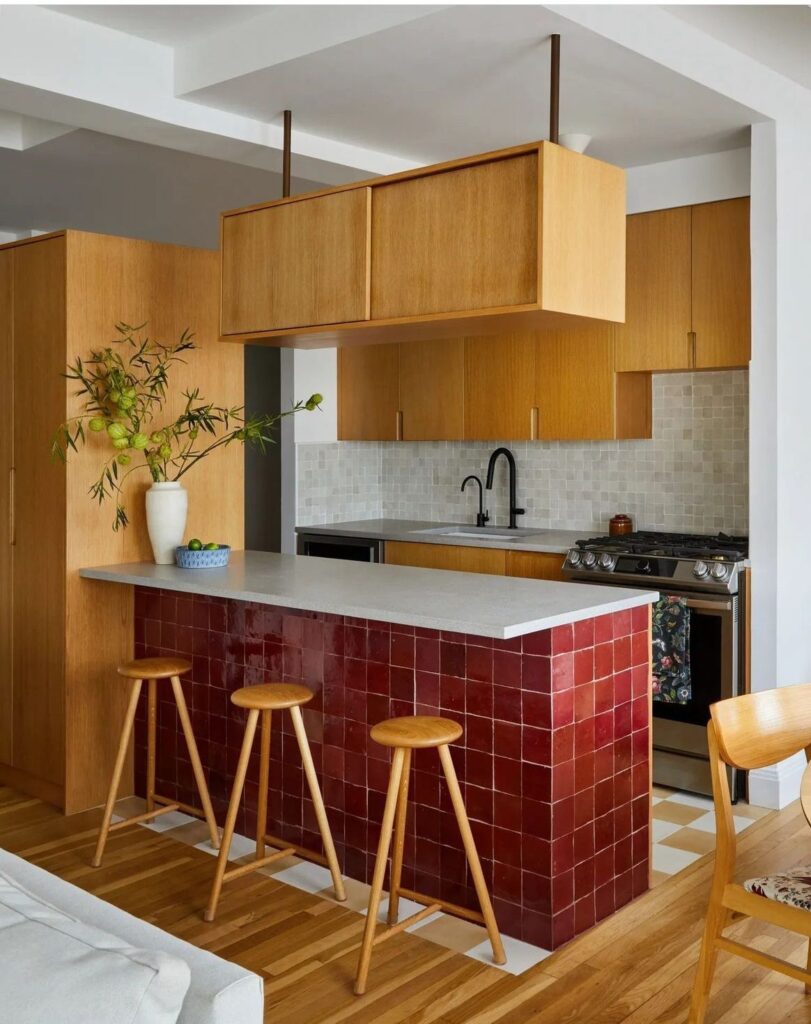 Eco-friendly kitchen materials including reclaimed wood and small tiles