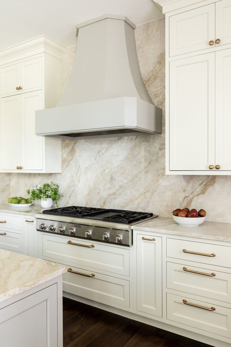 Luxury kitchen renovation in Westwood Plateau Coquitlam featuring white custom cabinetry, quartzite countertops, and mountain views by QUAY Construction