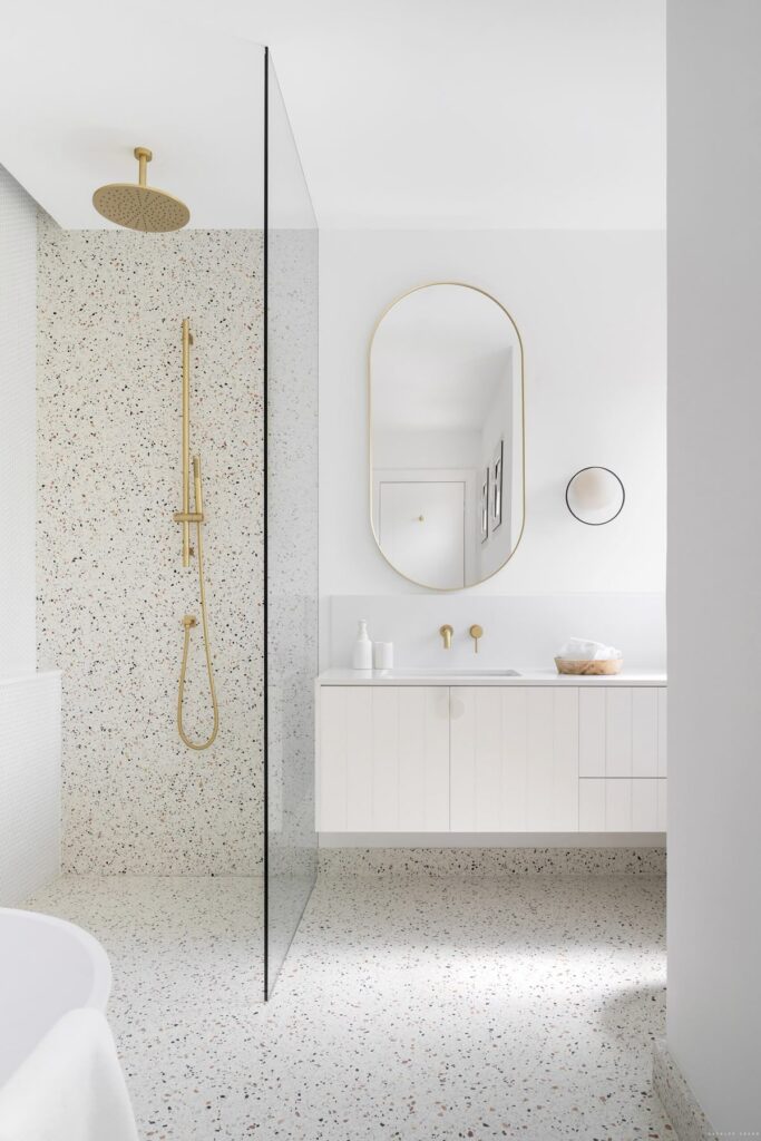 Spa-inspired bathroom renovation in Westwood Plateau with terrazzo stone and custom vanity by QUAY