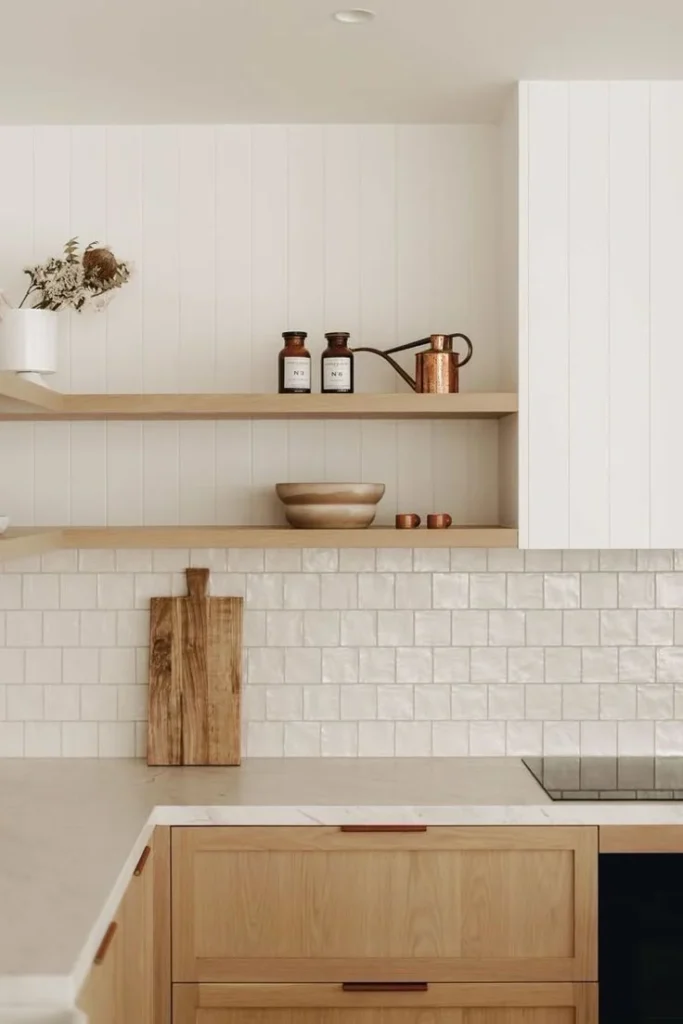 Scandinavian-style kitchen renovation in North Vancouver with white subway tile backsplash and natural wood cabinetry
