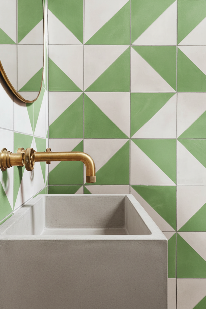 A luxury bathroom renovation in West Vancouver by Quay Construction featuring a custom walk-in shower with high-end terrazzo wall tiles and a built-in shower bench.