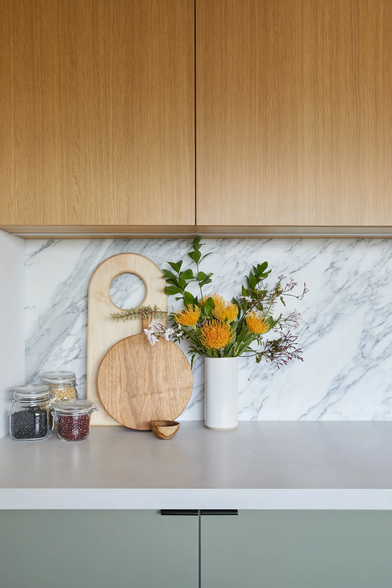 Architectural blueprints and tools for a condo kitchen renovation Vancouver project by QUAY Construction.