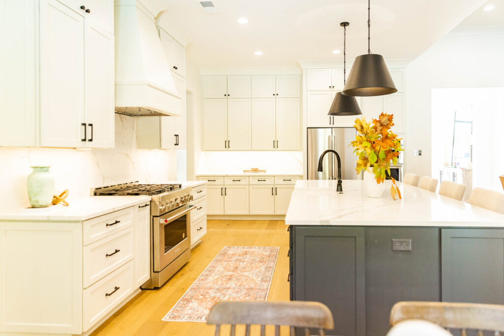 Final result of a modern condo kitchen renovation Vancouver project featuring custom cabinetry and luxury finishes by QUAY Construction.