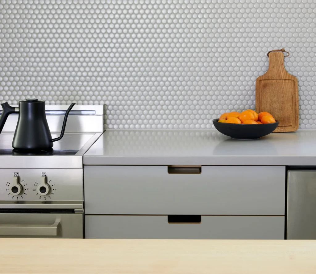 Architectural blueprints and tools for a condo kitchen renovation Vancouver project by QUAY Construction.