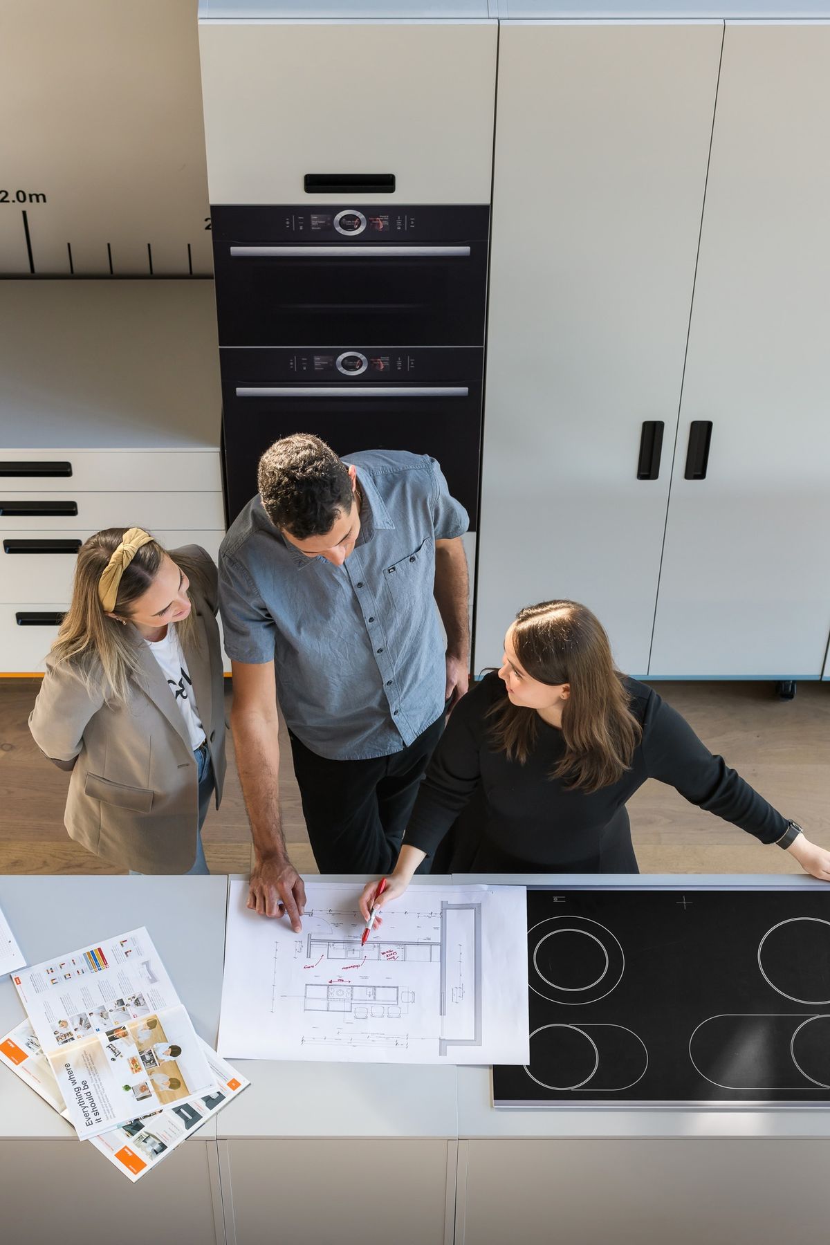 Modern kitchen renovation in Vancouver featuring white upper shaker cabinets and navy blue lower cabinetry.