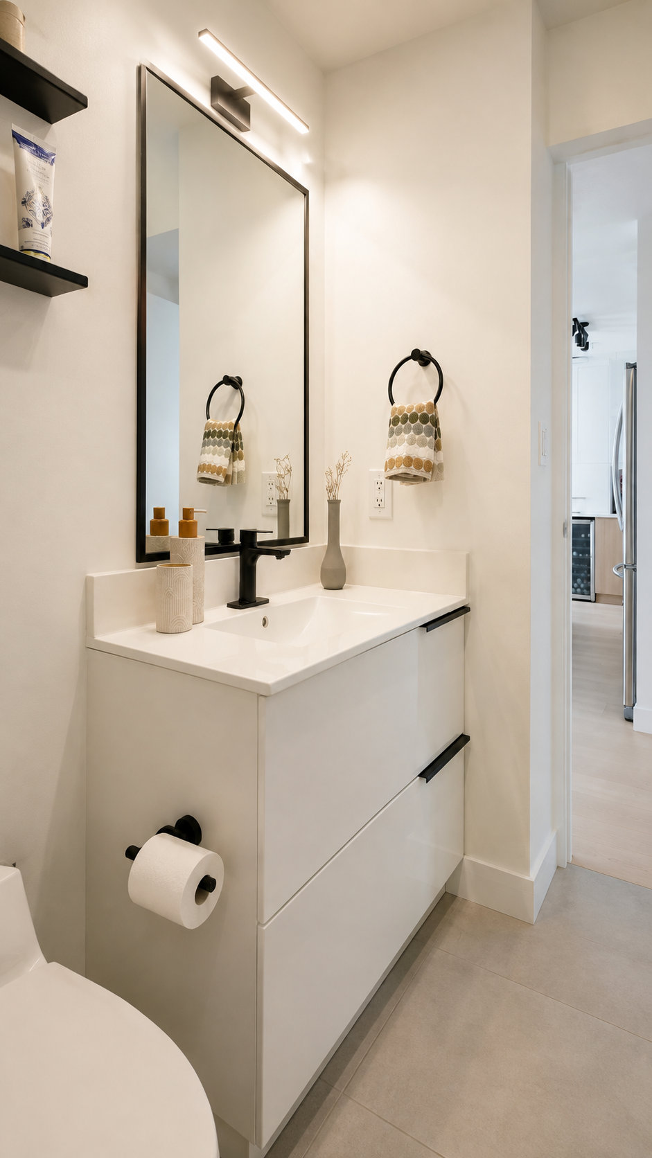 Modern bathroom renovation in a Yaletown Vancouver condo featuring contemporary tile and custom vanity storage