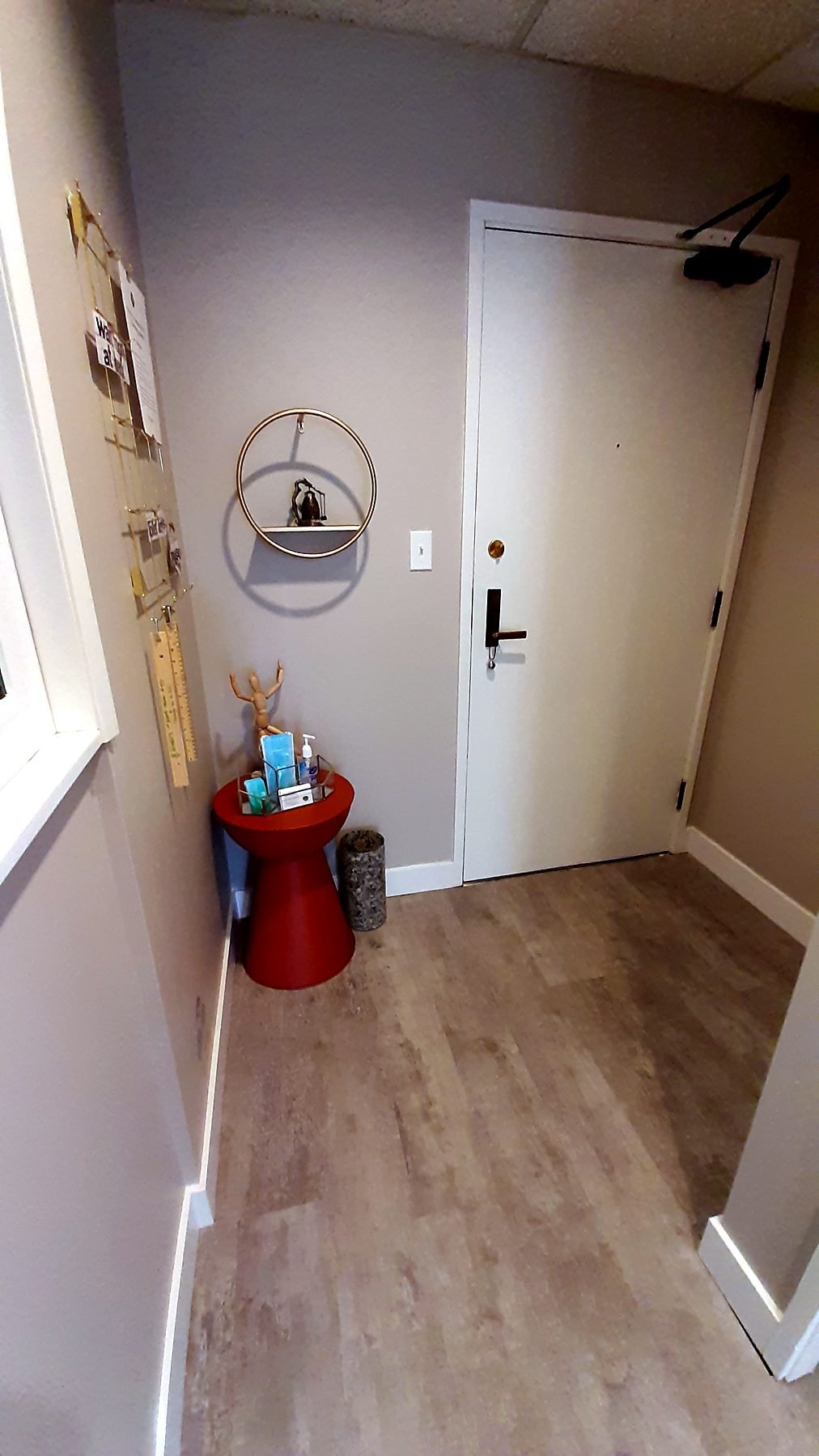 Office entry with new door hardware, baseboards and vinyl plank flooring