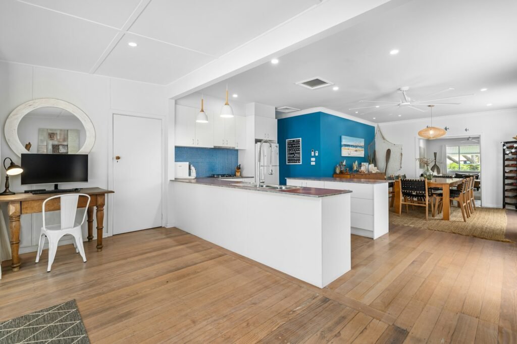 Open kitchen and dining area with wood floors