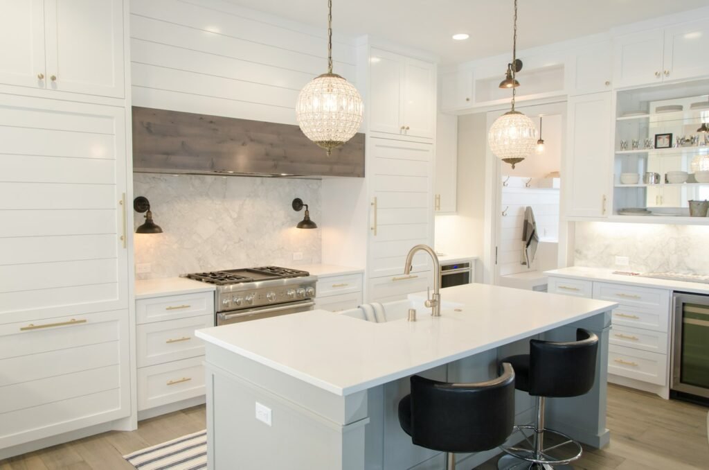 Bright coastal kitchen with white cabinetry and natural light