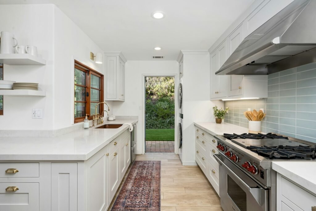 White coastal kitchen cabinets and range