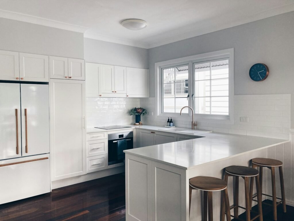 White Scandinavian-influenced kitchen cabinetry