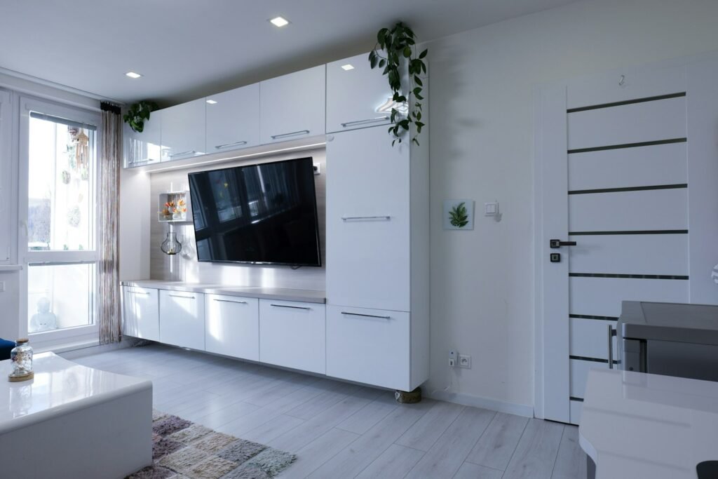 Minimalist condo with ambient statement lighting