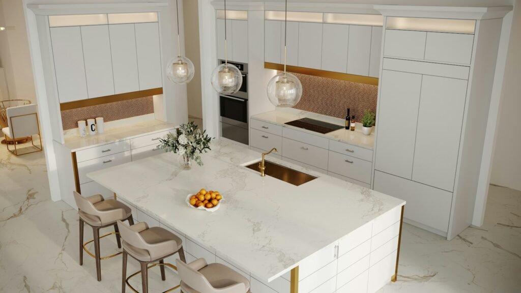 White contemporary kitchen with custom cabinets and gold backsplash