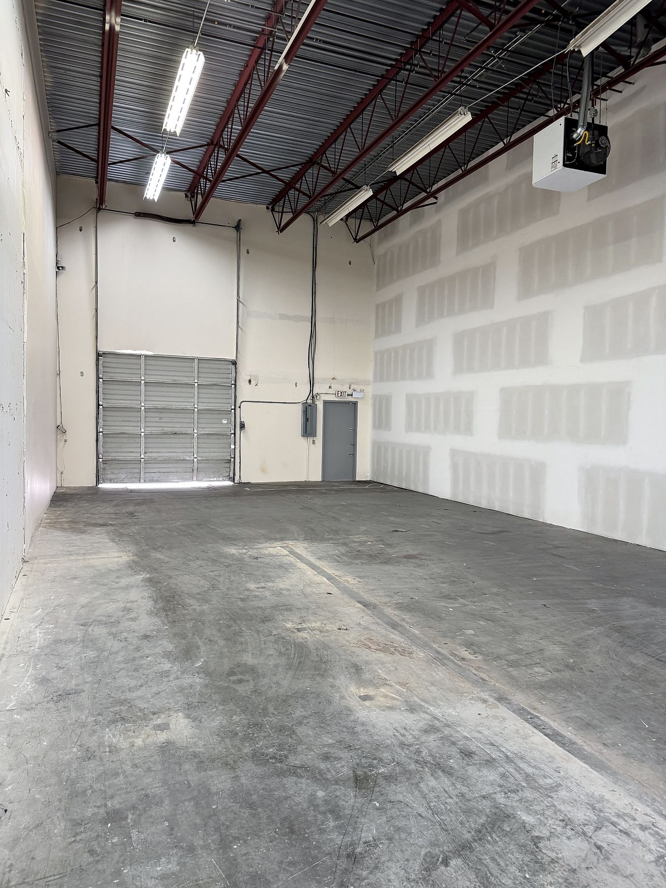 Finished warehouse unit in Delta with a new 22-foot insulated demising wall built by QUAY Construction