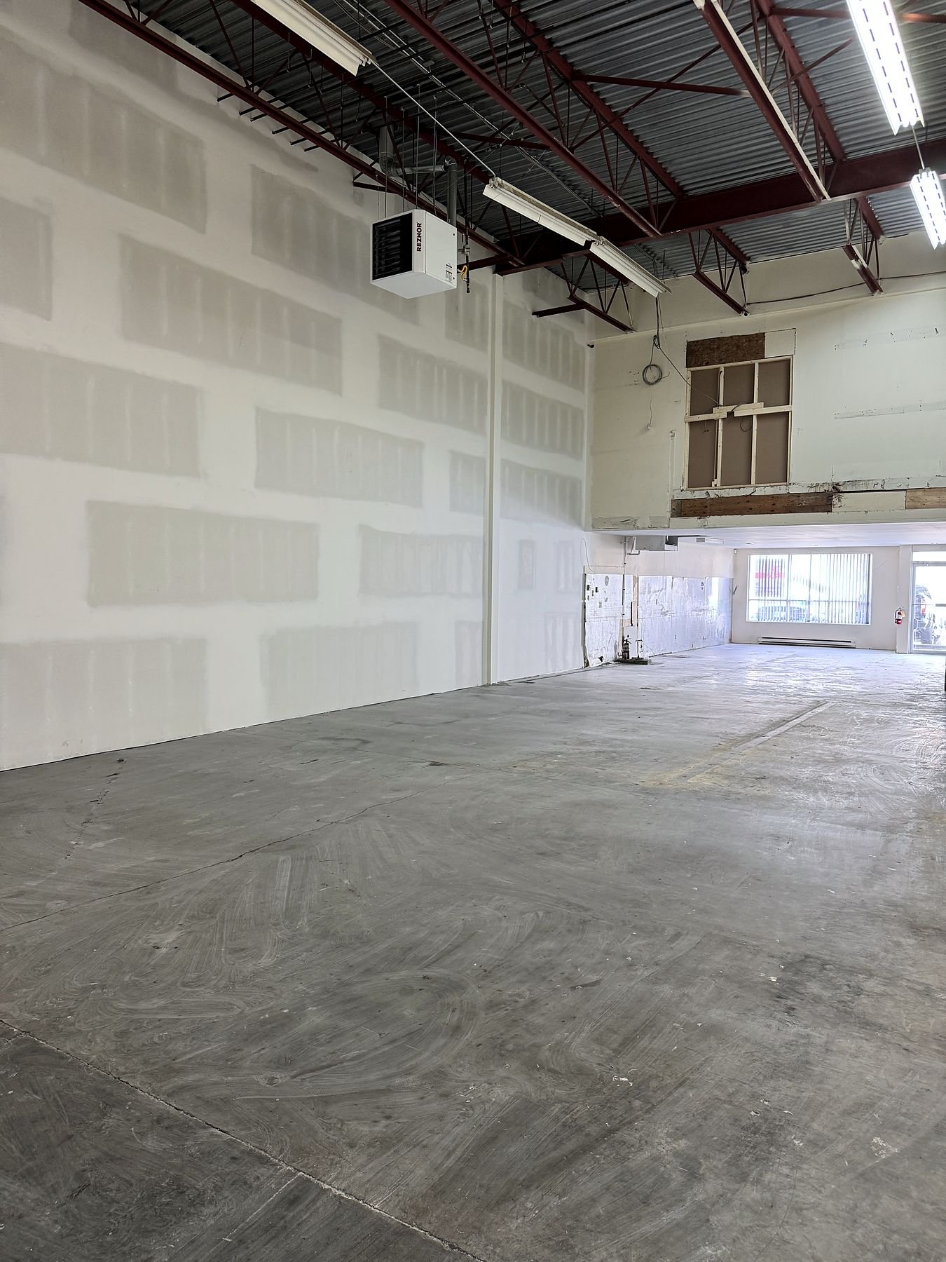 New 22-foot demising wall splitting a Delta warehouse into two units
