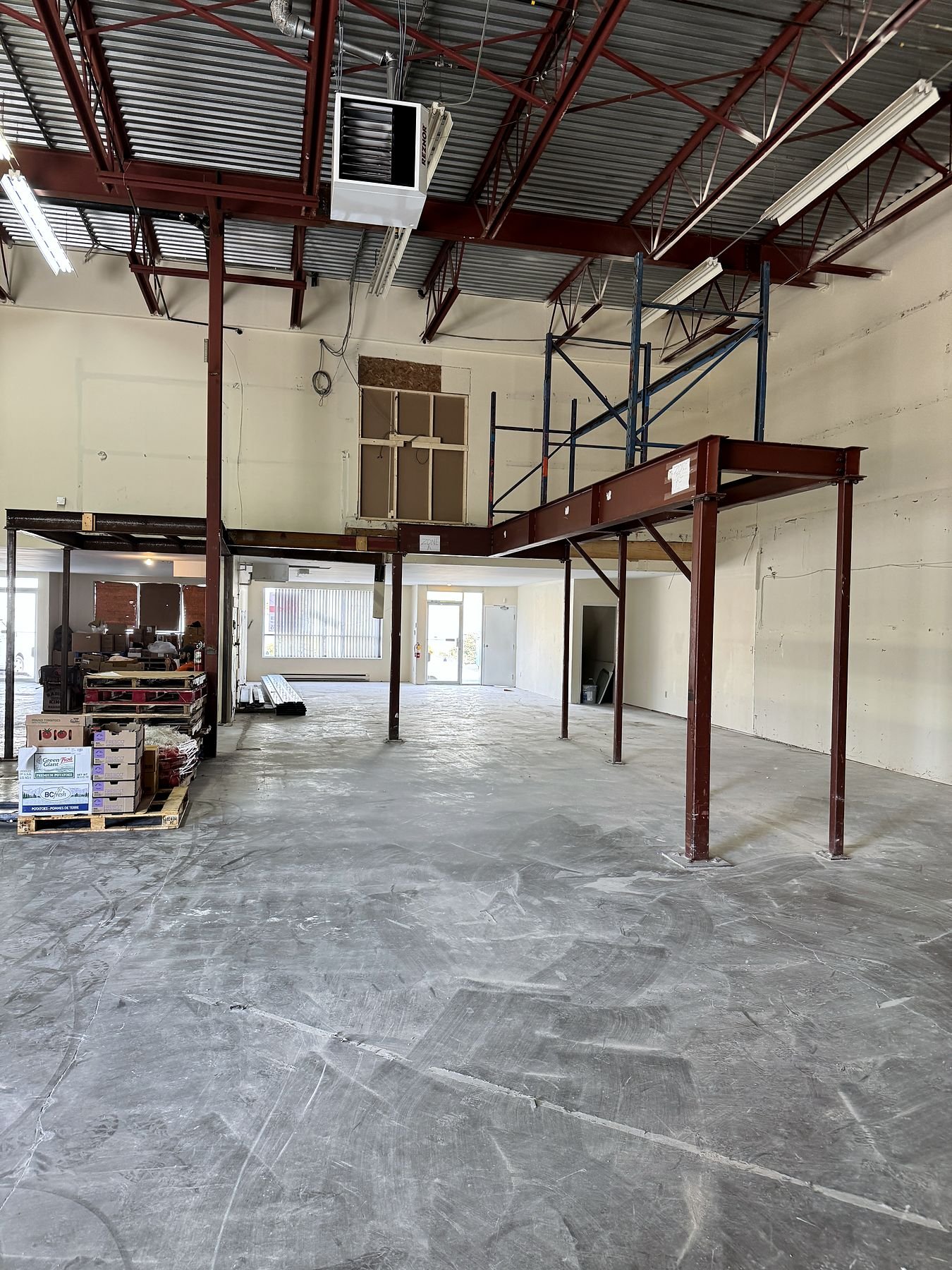 Remaining steel beams and columns being removed from the warehouse
