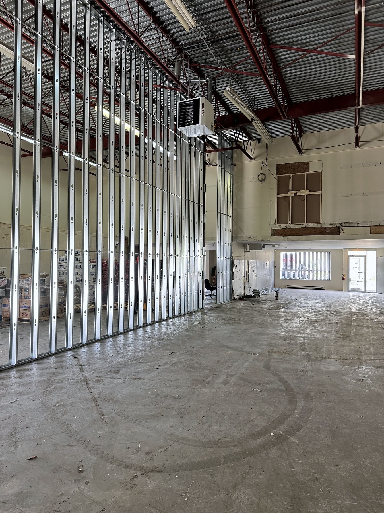 22-foot-high steel stud demising wall framing in a Delta warehouse