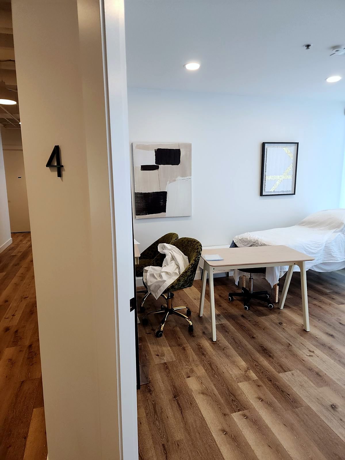 Doorway into a new treatment room with luxury vinyl tile flooring