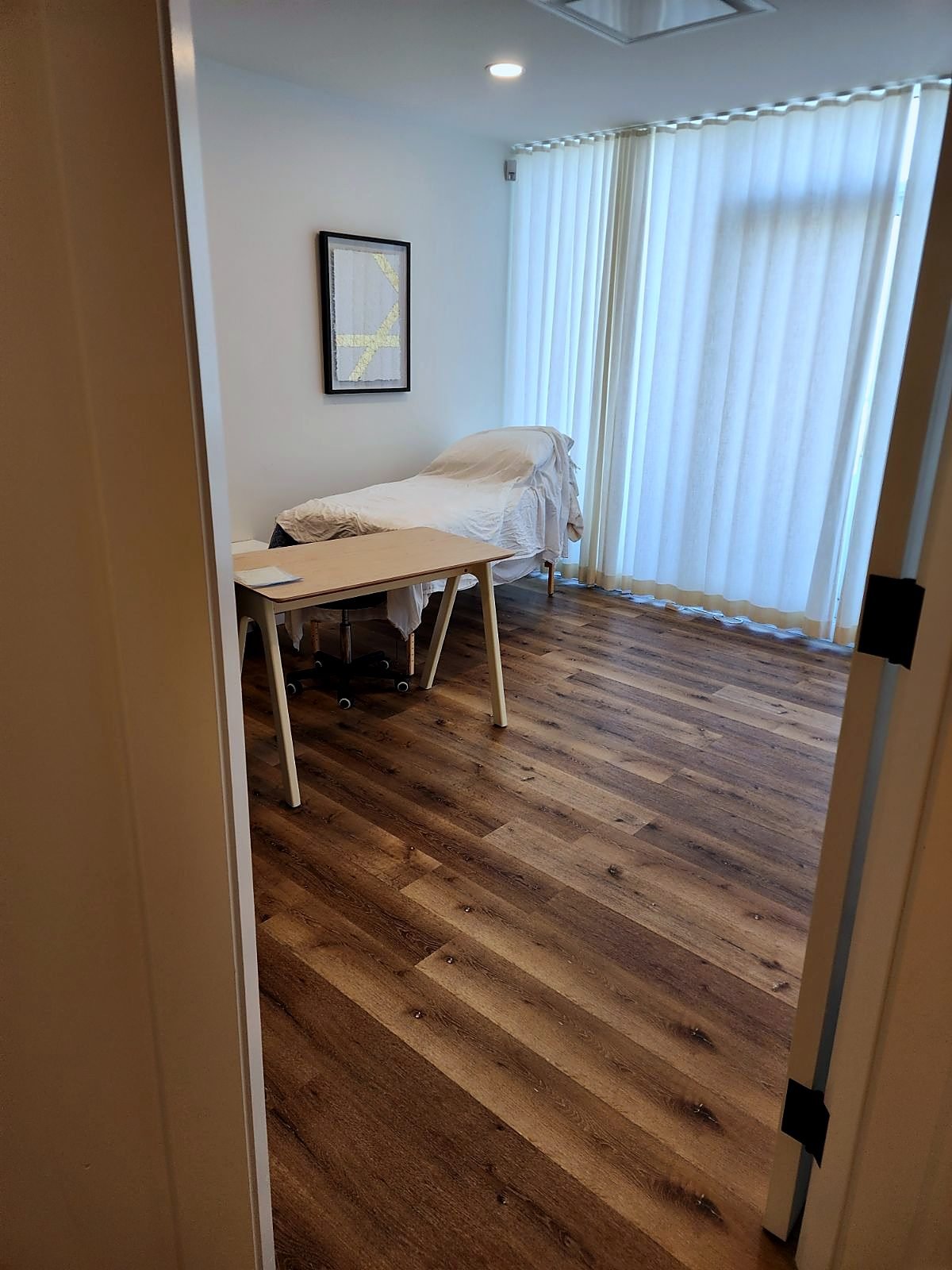 New clinic room with luxury vinyl tile flooring and fresh paint