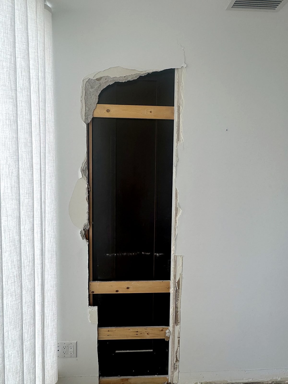 Wall opened to run new drain and water lines to a treatment room sink