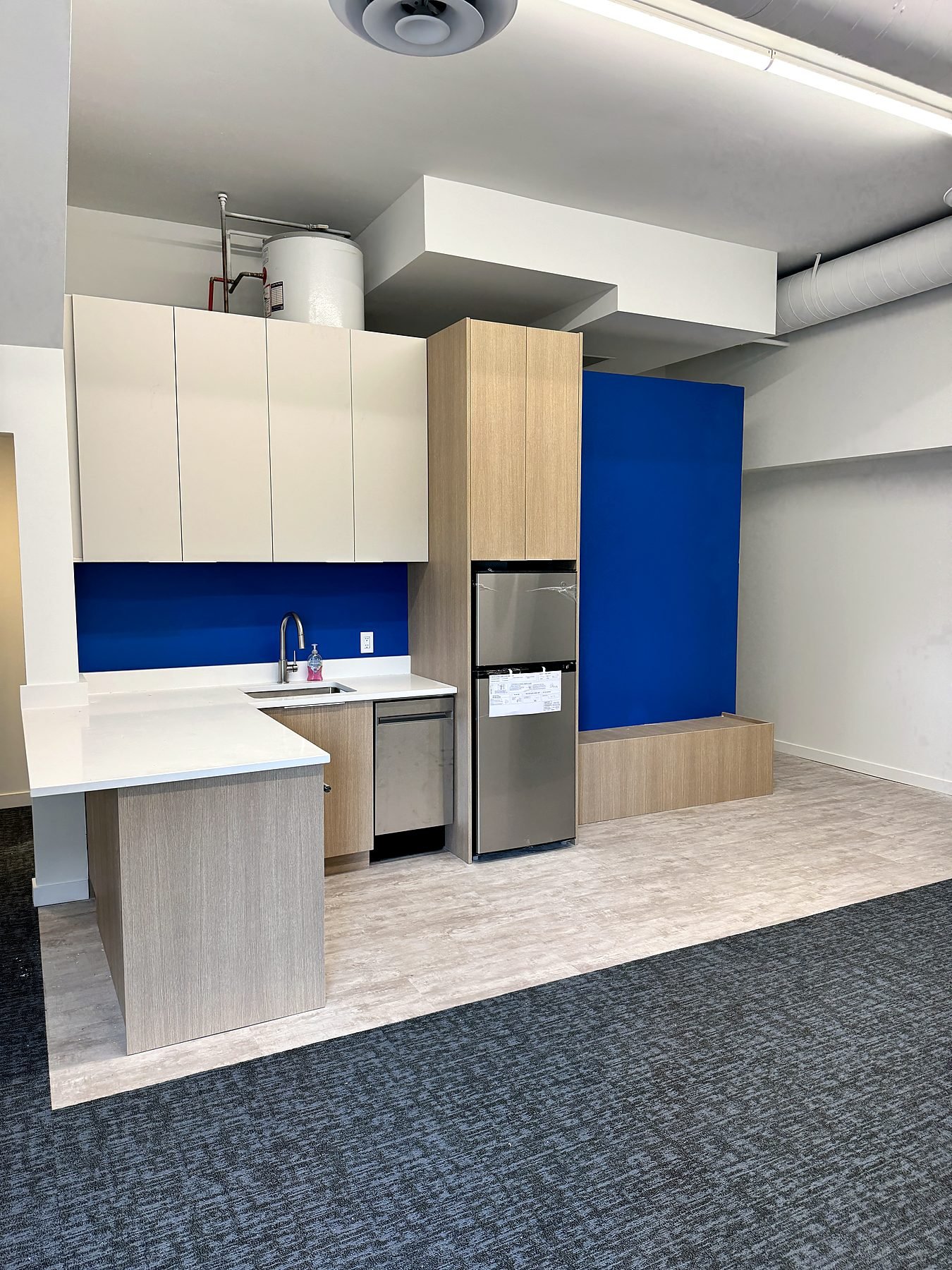 Main floor staff kitchen at Five Star Building Services in Burnaby after an office renovation by QUAY Construction