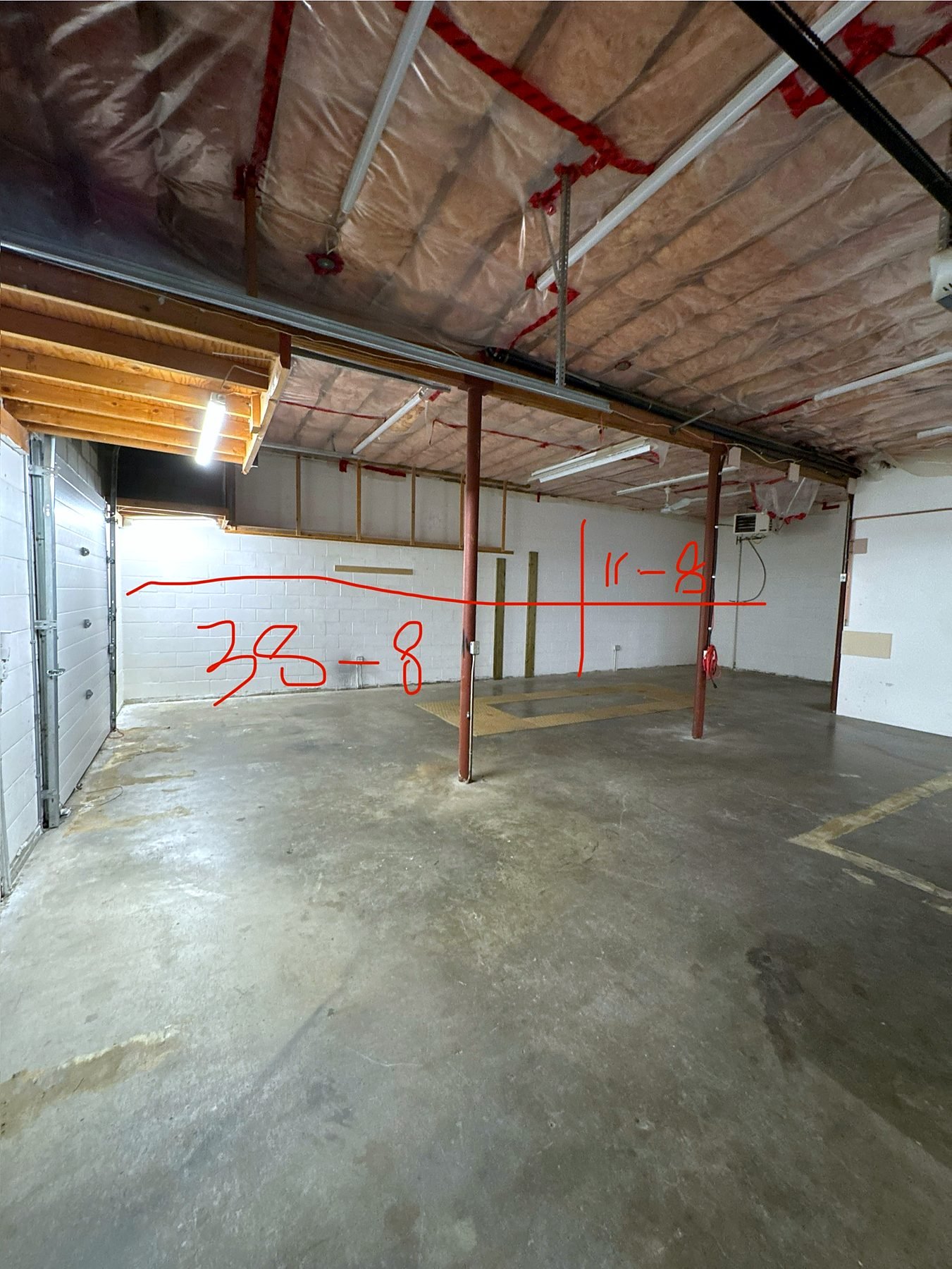 Empty Burnaby warehouse bay before steel pallet racking and pegboards were installed