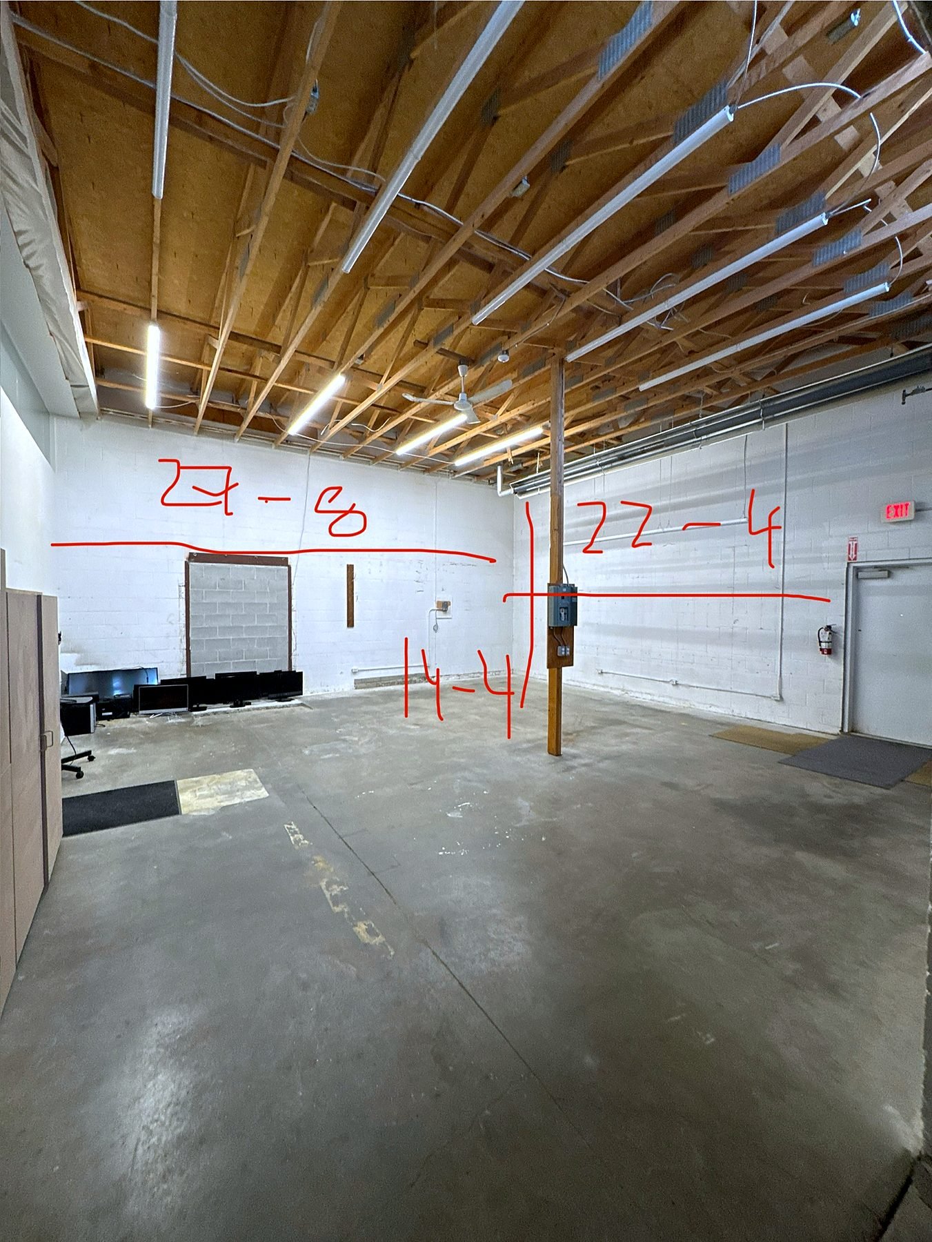 Burnaby warehouse before pallet racking install, with layout dimensions marked on the walls