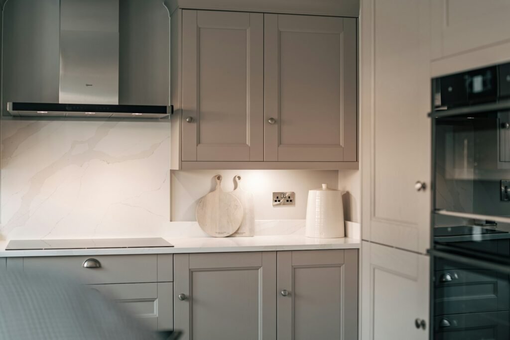 Galley kitchen with white cabinets
