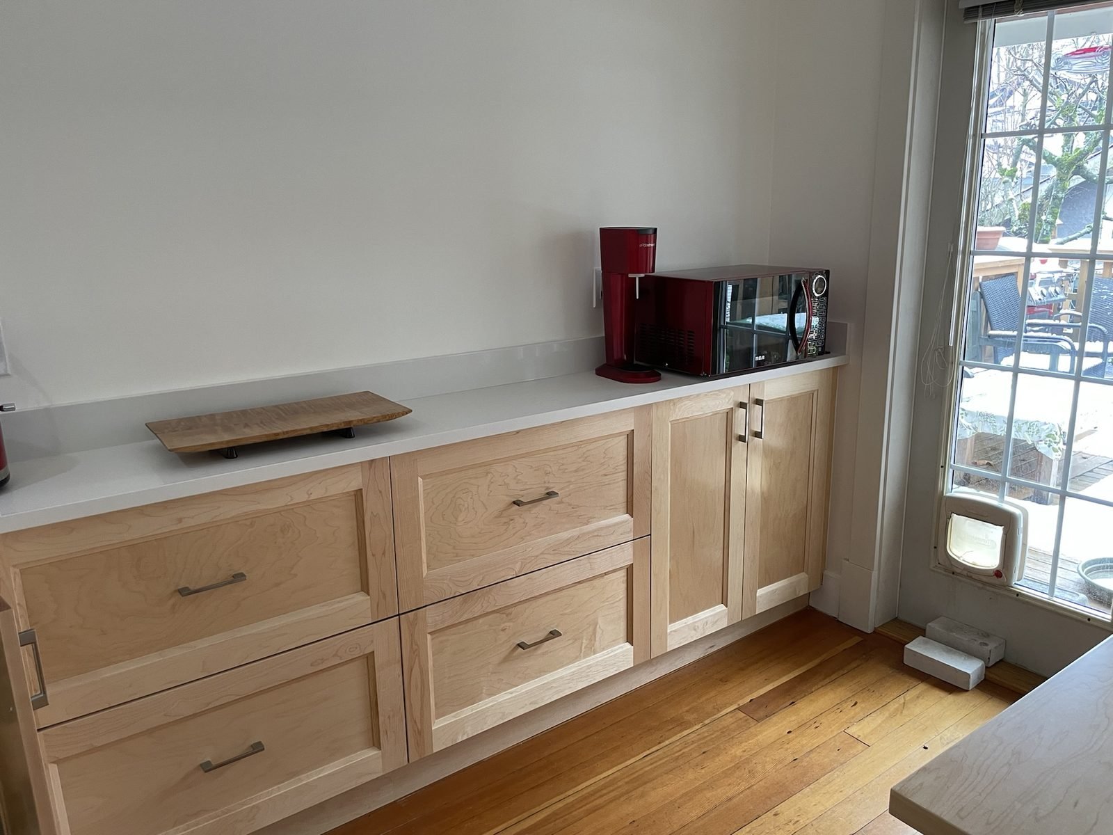 Kitchen extension with deep maple shaker drawers and quartz countertop in a Kitsilano, Vancouver home