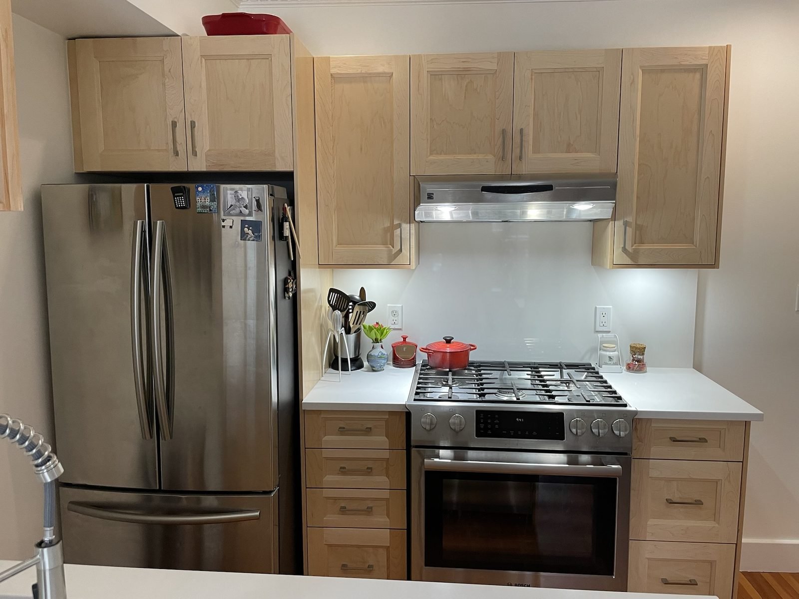 Natural maple shaker cabinets, white quartz countertops and a gas range in a Kitsilano, Vancouver kitchen renovation