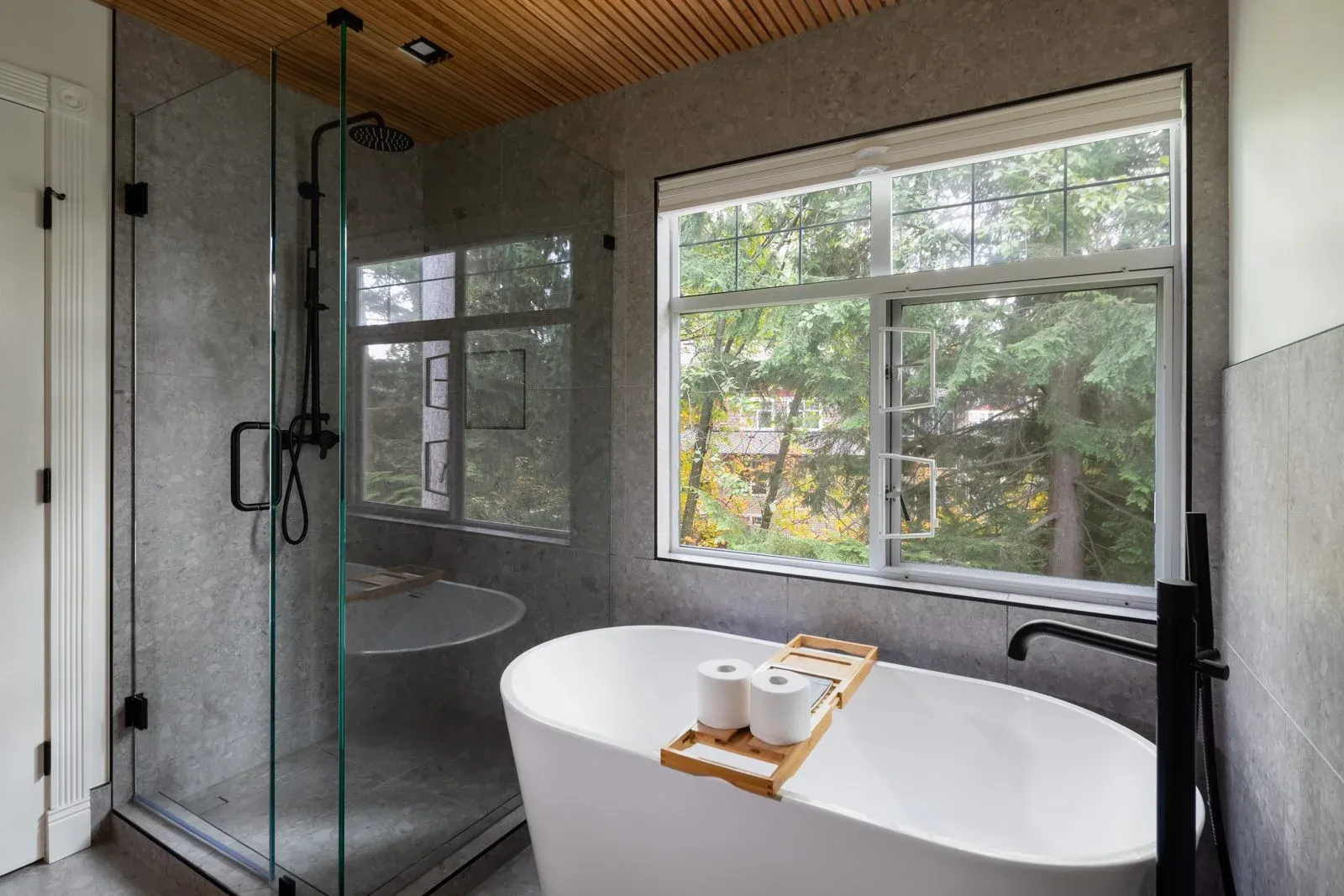 North Vancouver bathroom renovation: ensuite with freestanding soaker tub, glass walk-in shower and wood slat ceiling