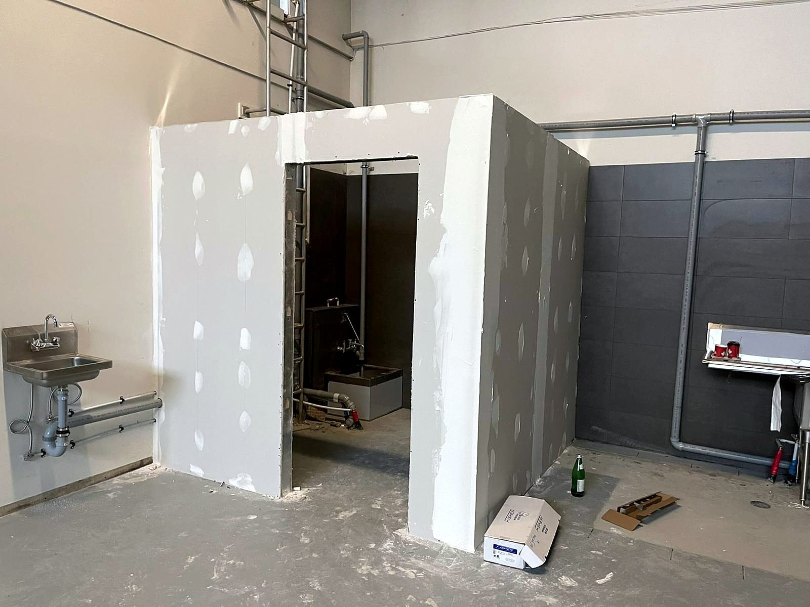 New janitor room framed and drywalled in the NutJar warehouse