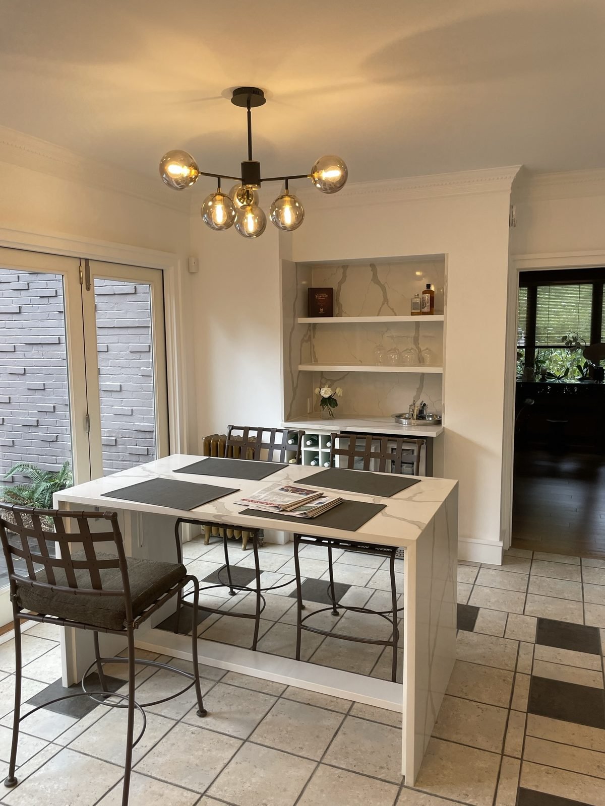 Custom waterfall dining table and pendant light built during a Shaughnessy, Vancouver kitchen renovation