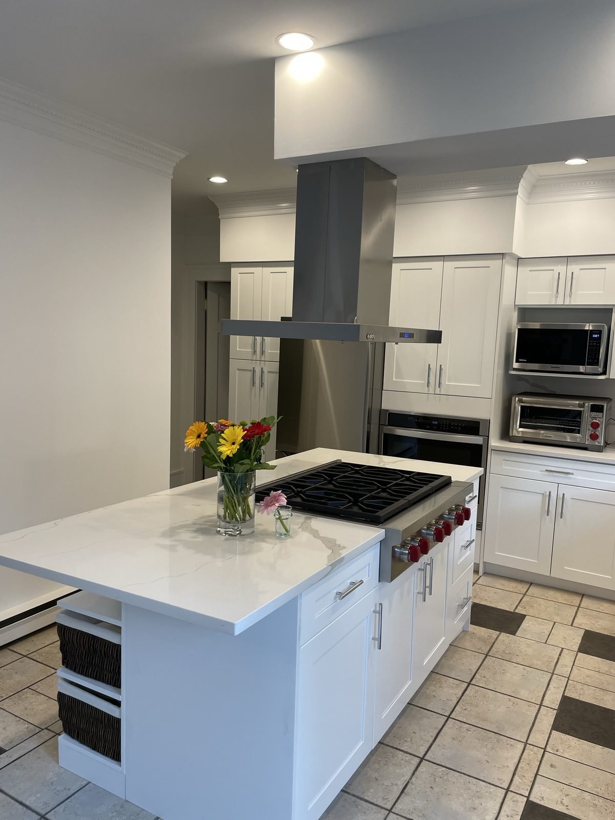Quartz kitchen island with professional-style gas rangetop in a Shaughnessy, Vancouver kitchen renovation